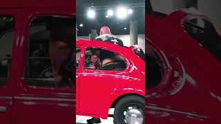 Old man sprints like mad with 700lbs car on his back