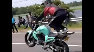 Motor bike stunts on public road -