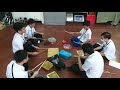 Teaching rhythmic improvisation using improvised instruments