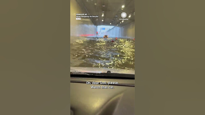 Car Plows Through Flooded Tunnel