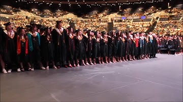 Charles Page High School Class of 2024 graduates sing the alma mater at graduation