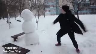 Russian guy trying to kick a snowman Resimi