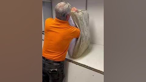 Fitting foam cushions into a cover using a vacuum