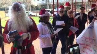 Group protests FirstEnergy using customs carols