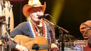 Willie Nelson soloing on guitar at the Greek