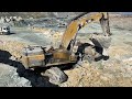 Caterpillar 385C Excavator Loading Trucks