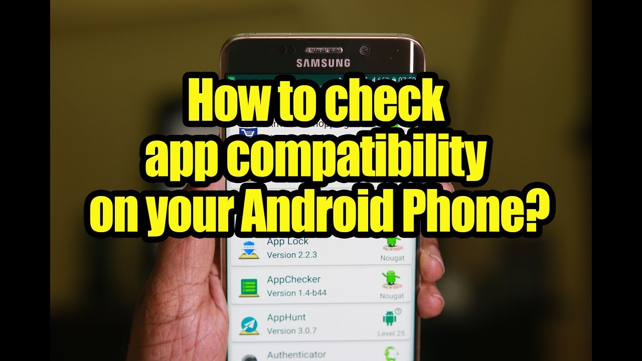  A hand holding a Samsung smartphone which displays 'How to check app compatibility on your Android phone' text with a list of apps below.