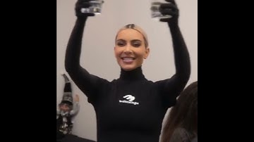 Thumbnail of Kim and Kourtney Kardashian drink alcoholic beverages before recording a Christmas song