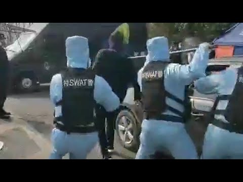 Coronavirus: 'SWAT' team tackle man in training exercise