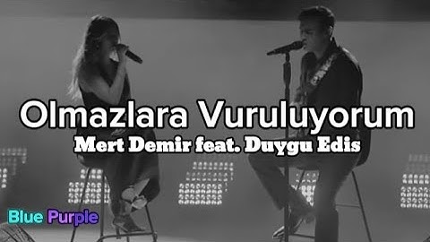 Mert Demir feat. Duygu Edis - Olmazlara Vuruluyorum Lyrics müzik video şarkı sözleri