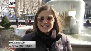 Tourists brave the frigid cold in NYC