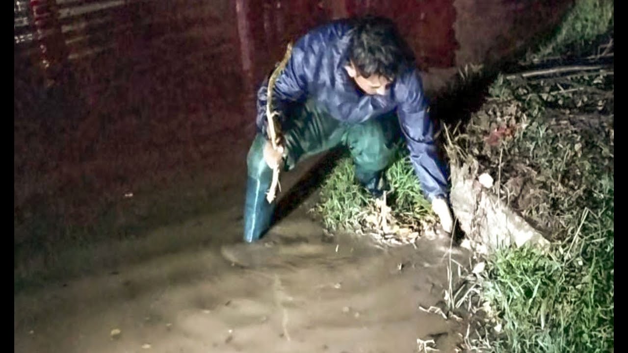 Unclogging Culvert Drain Water On Road Street After Heavy Rain Near ...
