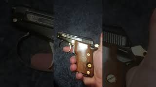 Beretta 21a bobcat in .25 auto! rare little gem of a pocket pistol. Gold n Wooden grips.