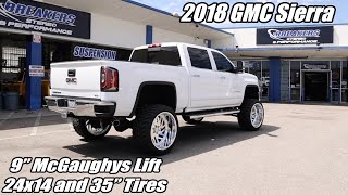 GMC Sierra 1500 Pickup with a 9' McGaughys Lift and 24x14 American Force wheels and 35' tires.