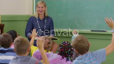 Teacher reads book to kids in school classroom | Stock Footage - Envato elements