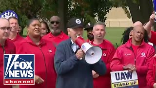 Biden takes bullhorn at UAW picket line in historic move for a president