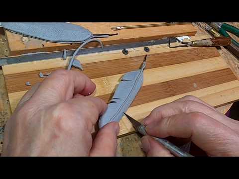 THE SCOUT Adding One Final Touch to the Clay FEATHERS