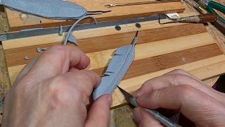 THE SCOUT   Adding One Final Touch to the Clay    FEATHERS