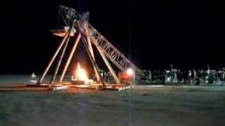 Flaming Piano tossed by Trebuchet