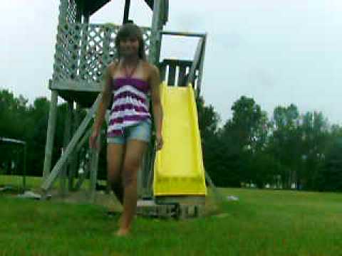 Courtney And Angela going down a slide backwards, ...