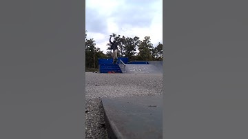 Backside Boardslide down a little handrail.