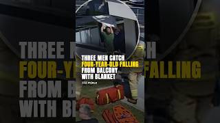 Three men catch four-year-old #falling from #balcony with blanket