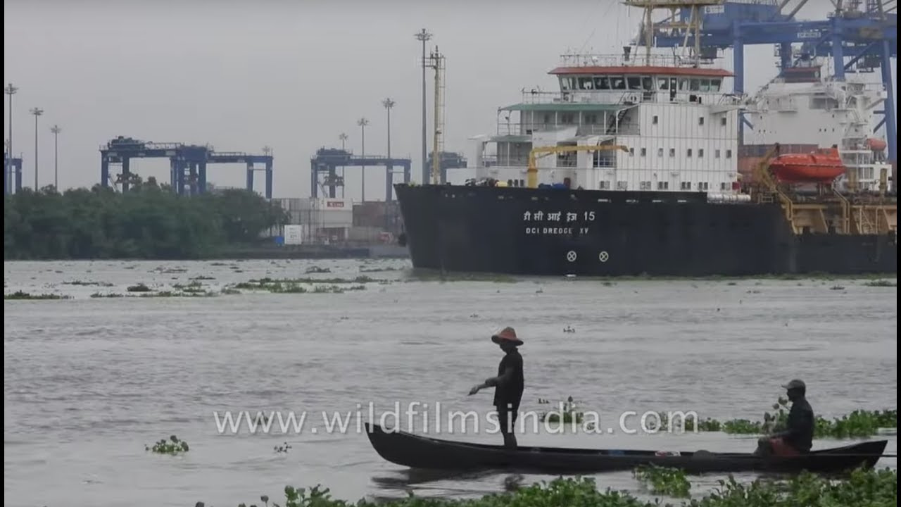 nepal flag 'DCI Dredge XV' vessel sails at the harbour while fishermen are fishing in Kochi