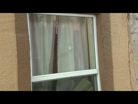 Woman hospitalized after being shot while sleeping in apartment