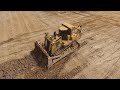 Cat D9R pushing dirt - Drone video