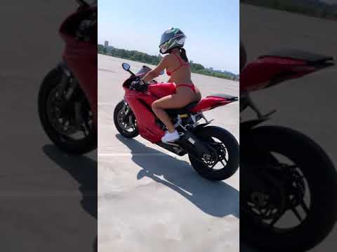 Sexy bikini women ride A motor bike