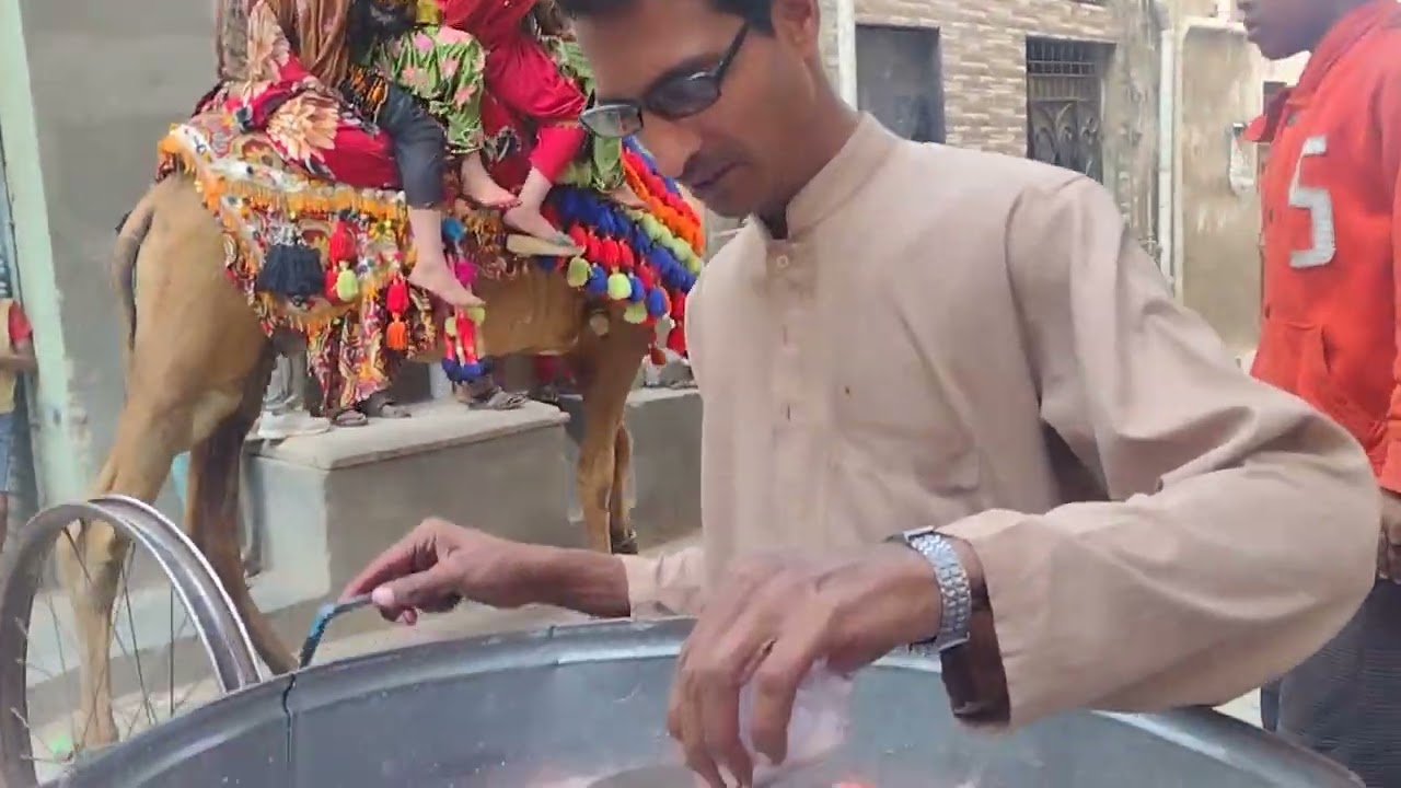 Sweet Delights: Sugar Candy Production & Camel Rides in Karachi Streets