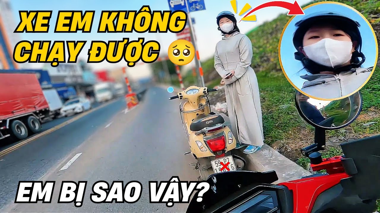 Gặp em gái xinh đẹp đứng bên chiếc xe bị sự cố giữa dòng người ra vào có vẻ em đang rất vội vã