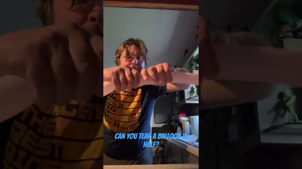 Tearing a balloon IN HALF. 
