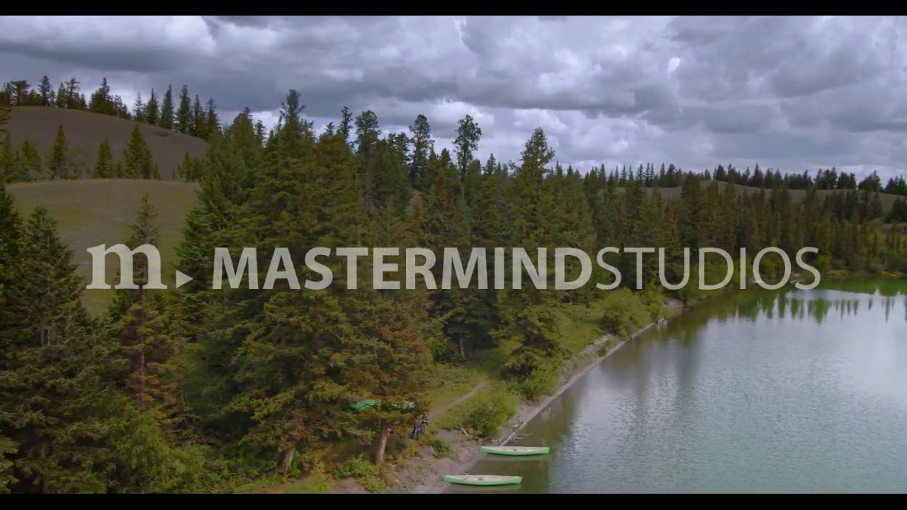 Aerial drone view revealing shore with canoes at Big Bar Lake, BC YouTube