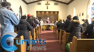 Catholics Remember All Souls at Holy Cross Cemetery Field Mass