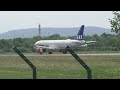 Zurich airport SAS airplane Airbus A320-232 OY-KAP landing.