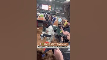 TRAVIS SCOTT GIFTED JORDAN 1s LOW “REVERSE MOCHA” TO A YOUNG FAN AT A CELEBRITY SOFTBALL GAME! 👀🤯