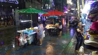 Fun in the rain. Walking Street, PATTAYA.