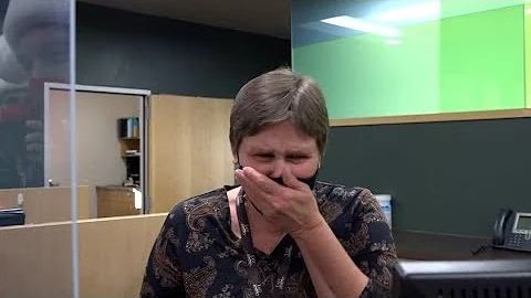 Bank teller sobs when Secret Santa surprises her w...
