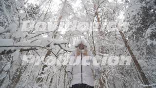 The Girl Shakes The Snowy Branches Of A Tree On Herself From The Winter Forest.
