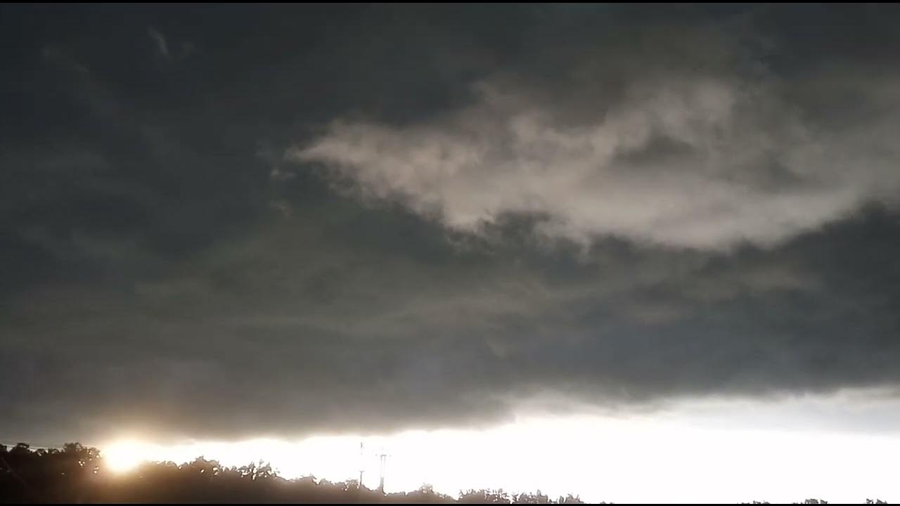 Beautiful Black Rainy Thick Clouds Covering The Sky And Sunlight in