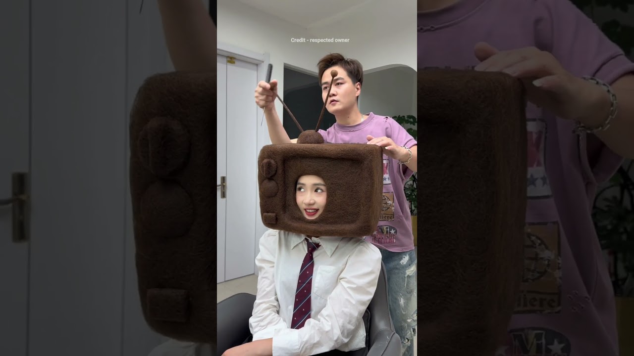 This girl wanted to watch TV everywhere then barber made it with her hair