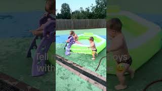 Toddlers are pushing each other down the slide and into the paddling pool!