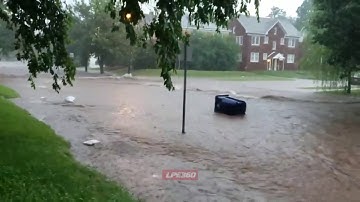 Trash can navigates flooded streets