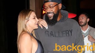 Larsa Pippen and Marcus Jordan pose for pictures before leaving a dinner date in West Hollywood