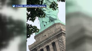 Person Spotted Climbing Up Statue Of Liberty