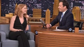 Jessica Chastain flashes her cleavage in low-cut black jumpsuit on Jimmy Fallon show