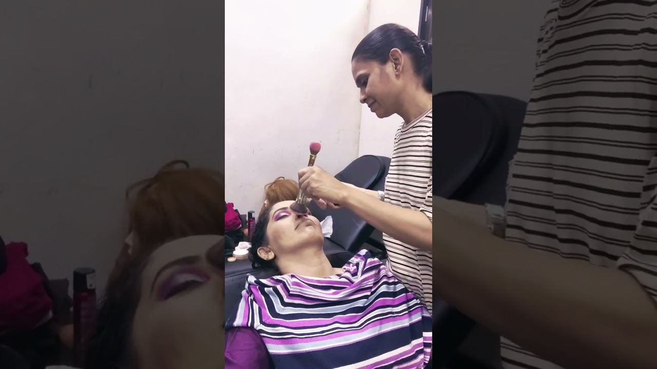 Explaining how to do south indian makeup to my class students.