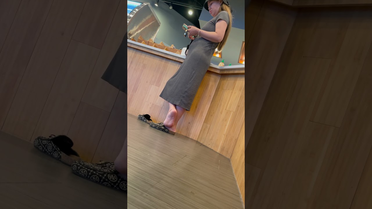 Japanese woman standing in line 