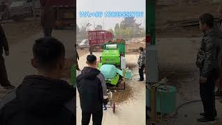 Green storage baler prototype test, many people gathered to watch the machine performance